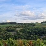 french landscape with blue skies and white clouds