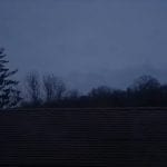 a dark morning that looks like night time