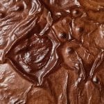 the top of freshly baked brownies in a glass tray