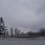 a snow-dusted roof on a cloudy morning