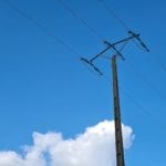 electric wire pole with blue sky and white clouds