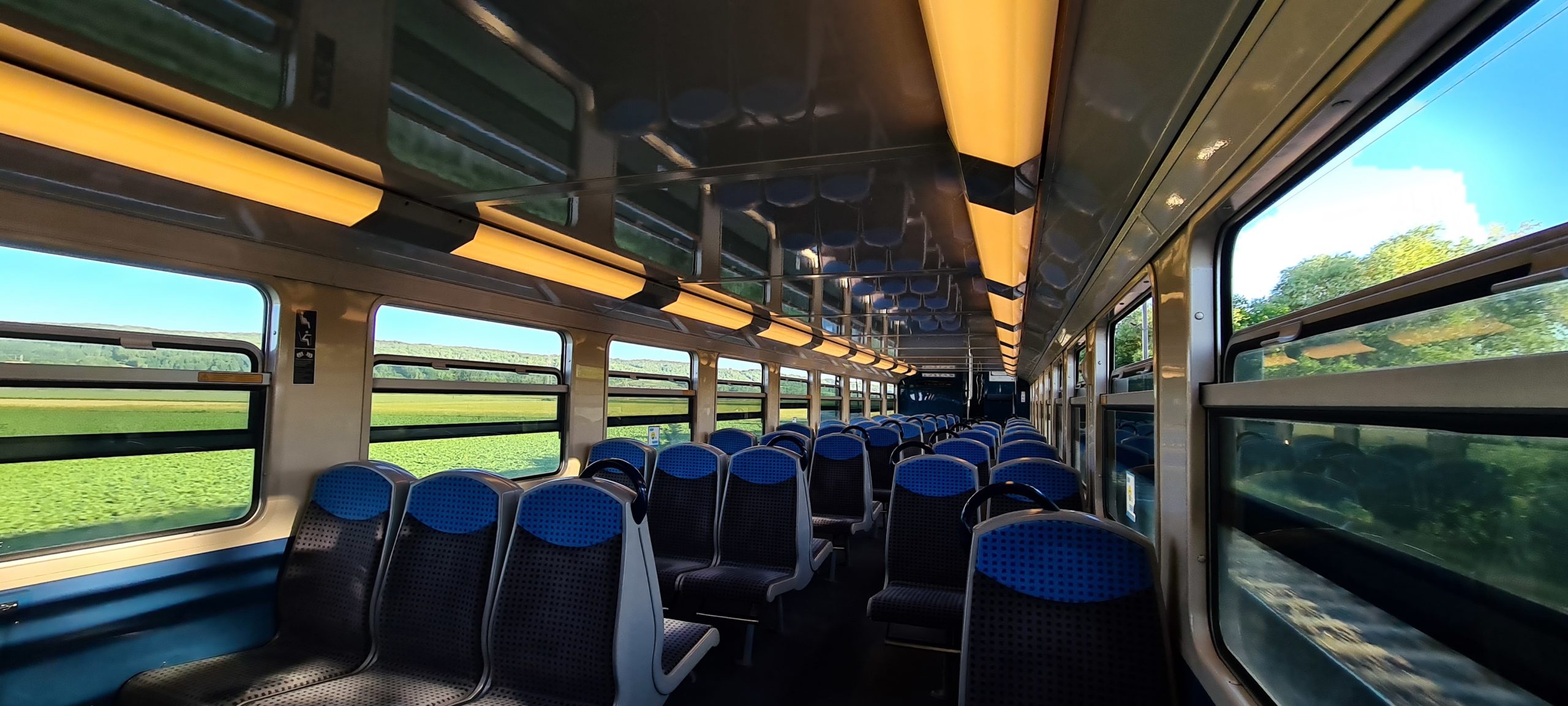 inside an empty passenger train car while moving