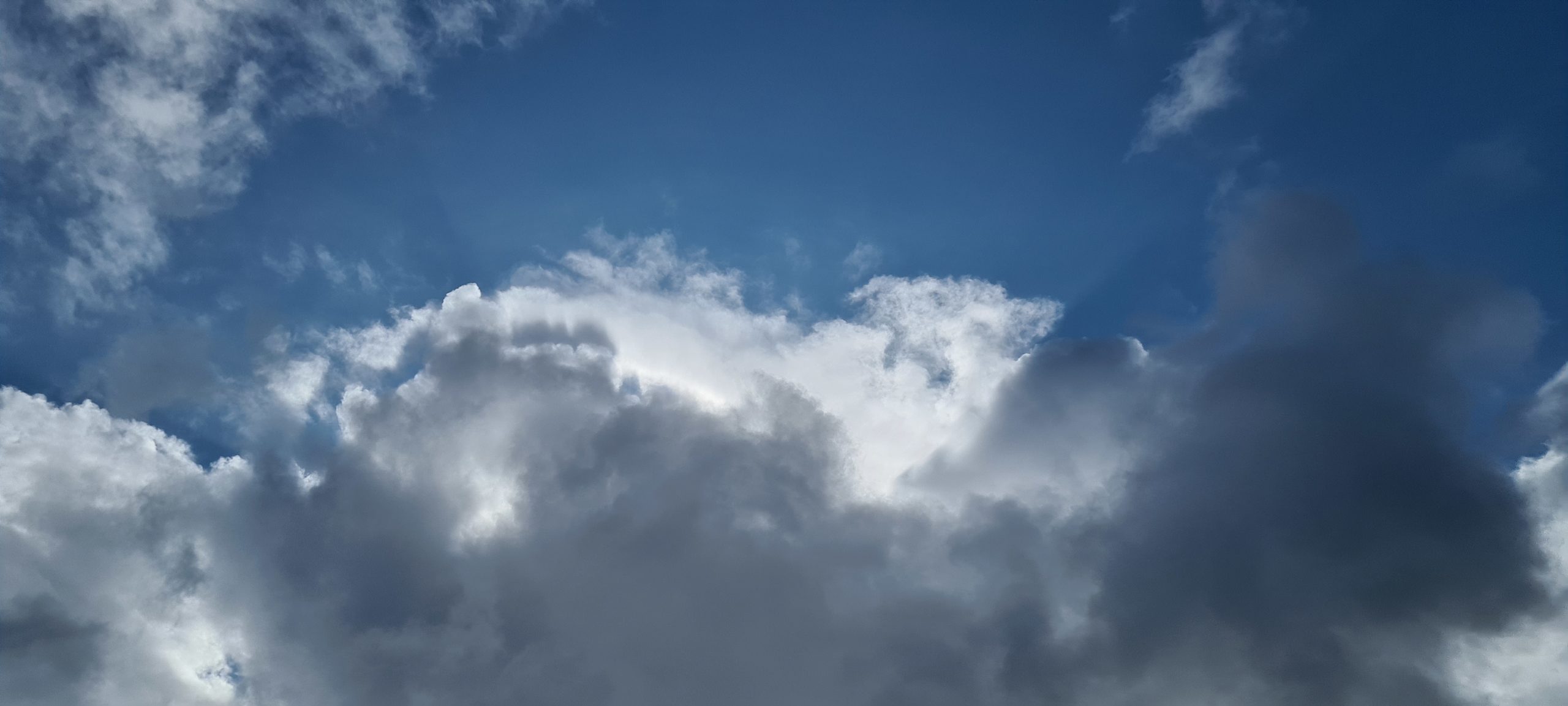 white clouds covering the sun