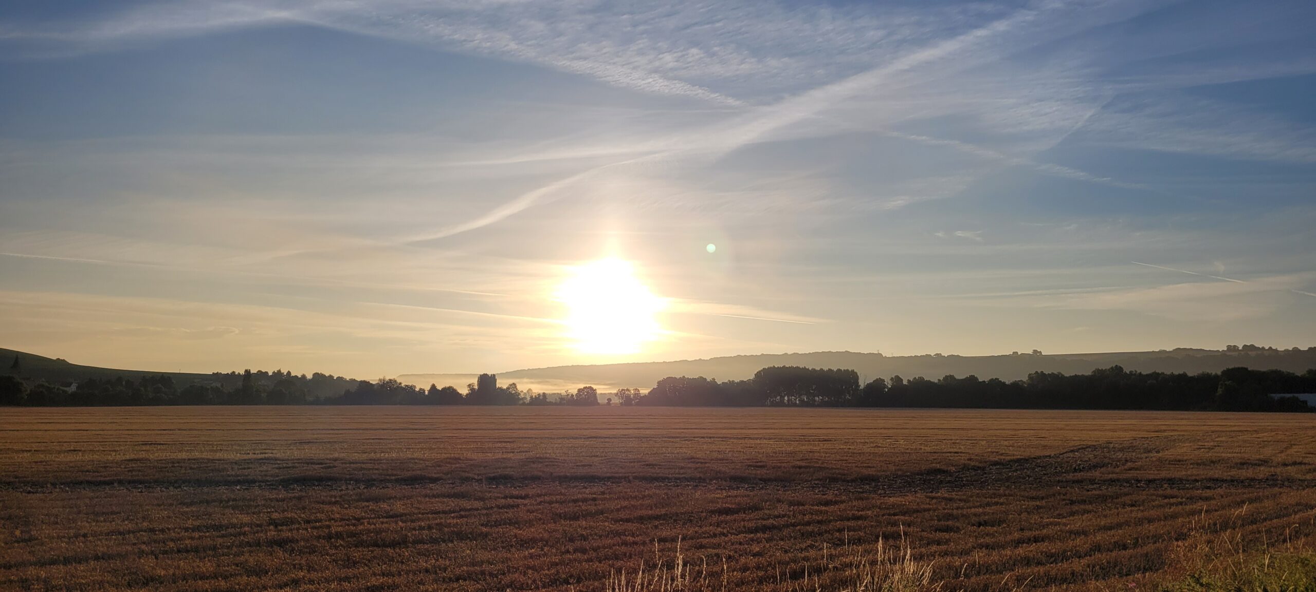 sunrise over farm fields