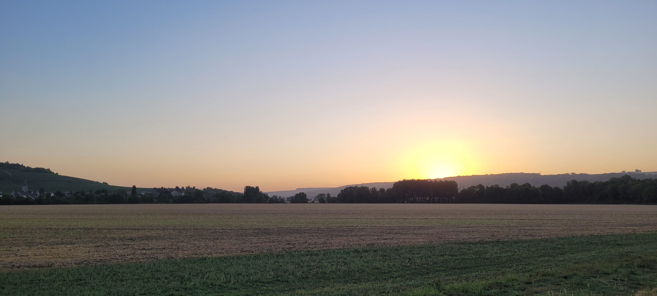 sunrise over farm fields