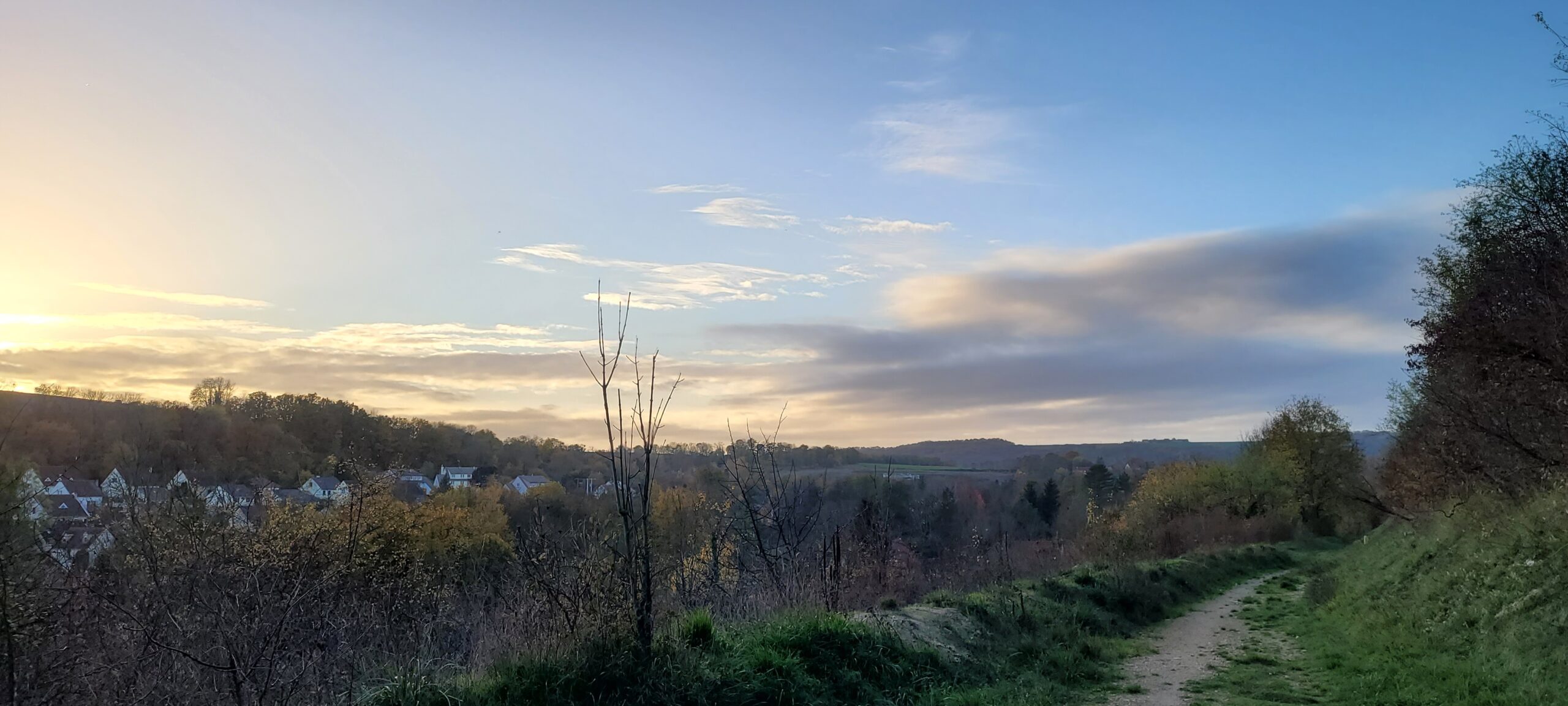 slightly cloudy sky at sunset over countryside