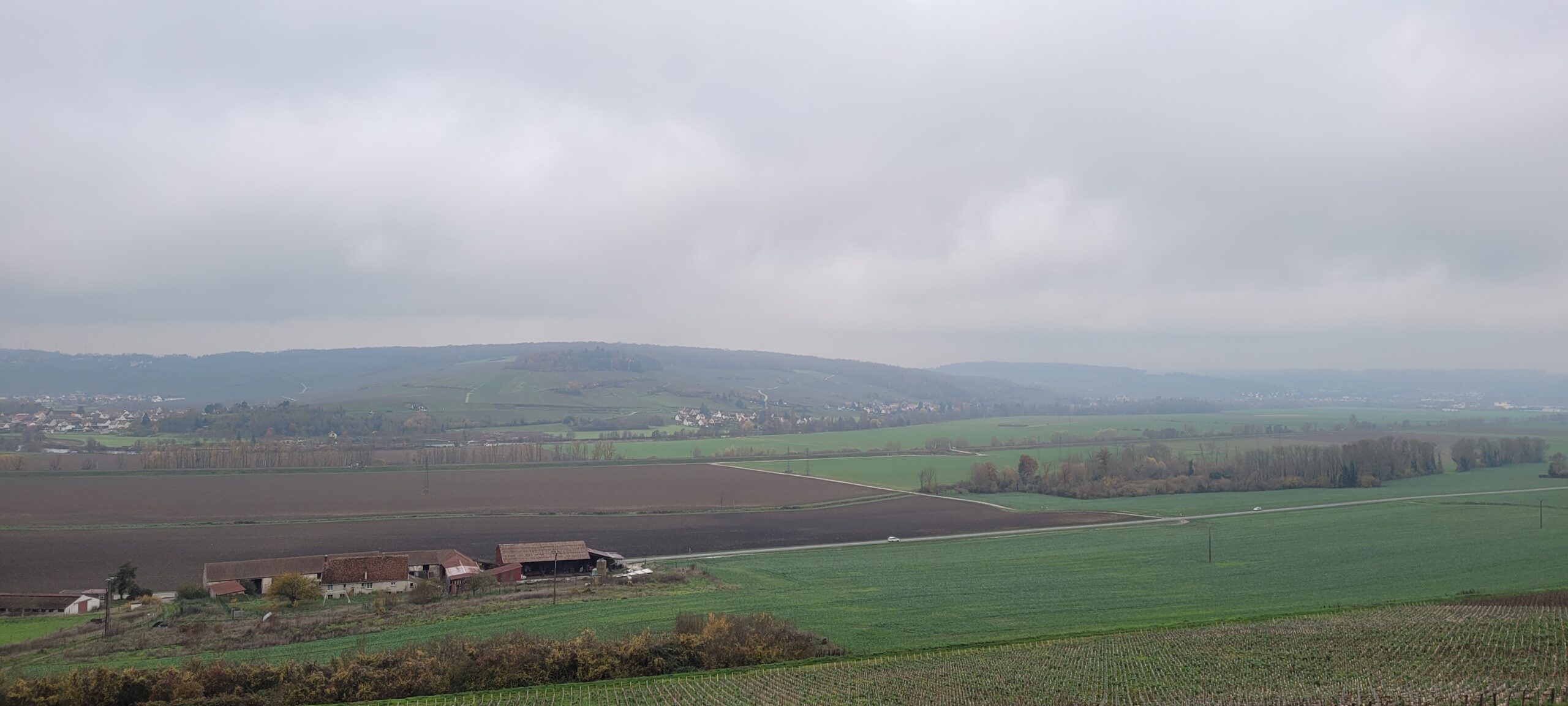 a cloudy and foggy sky over french countryside