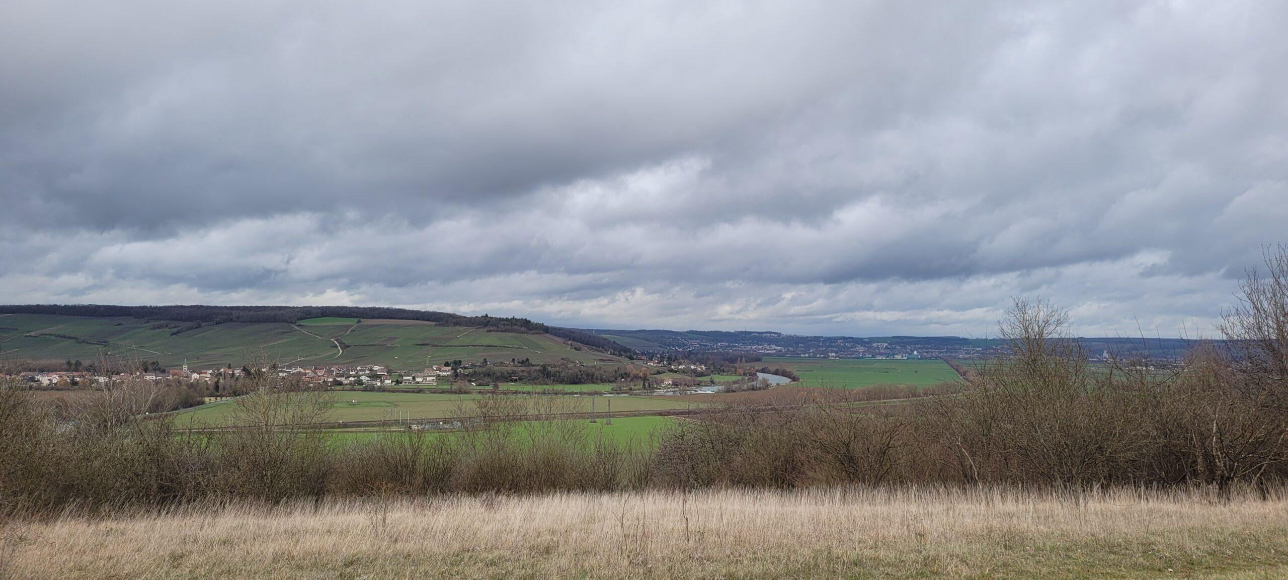 a cloudy sky over French countryside